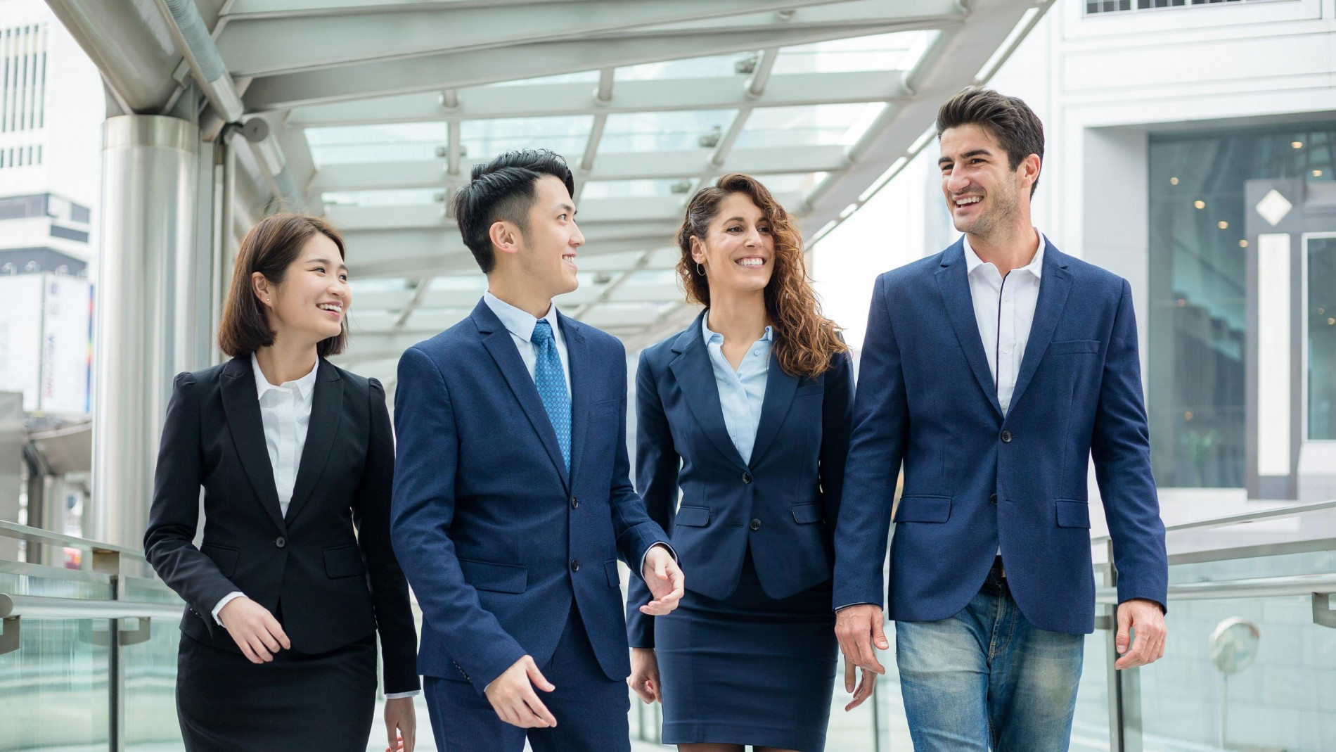A group of 2 women and 2 men having a discussion